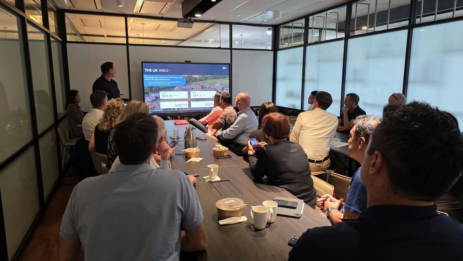 John Treacy of On Invest presenting on the UK housing supply gap to attendees in Singapore